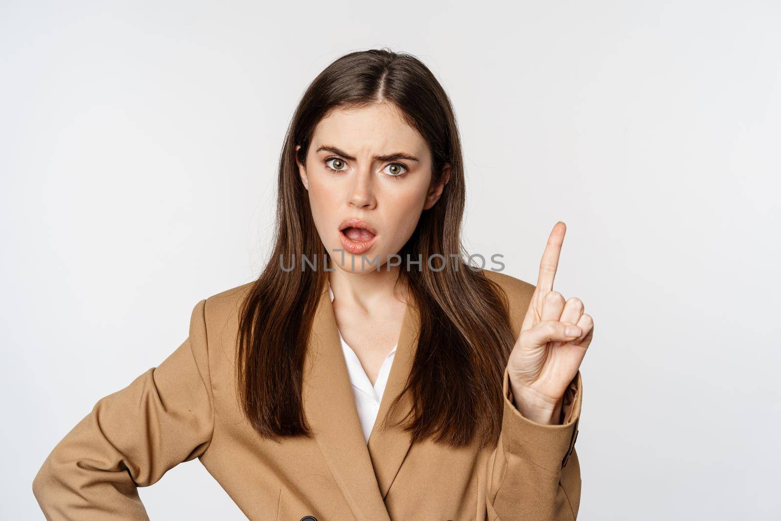 Disappointed lady boss, business woman shaking finger taboo sign, decline, prohibit something, disagree, standing over white background.