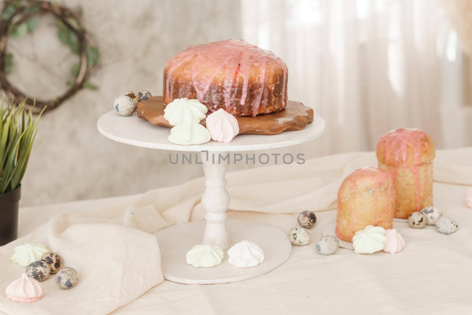 A set table for the celebration of Easter. Cakes and quail eggs on the Easter table. Happy Easter.