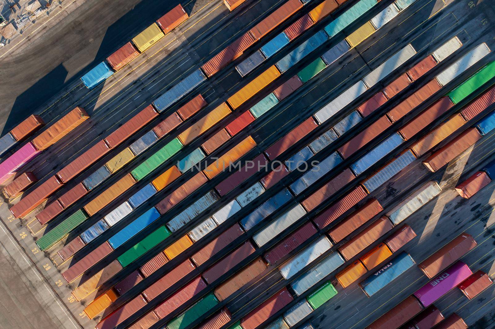 Copenhagen, Denmark - January 06, 2022: Aerial top down view of multi colored containers at Copenhagen Malmo Port.