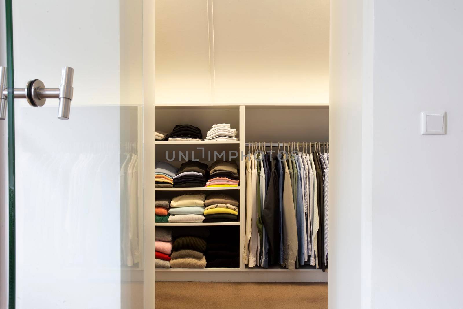 walk -in closet with cloth and shelf at home modern stylish white design, interior storage concept home