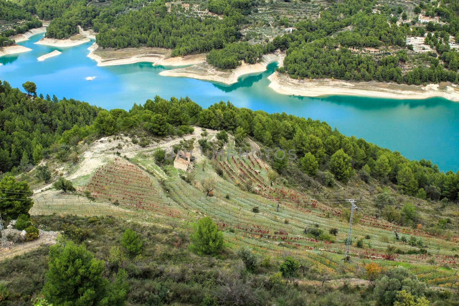 The swamp of Guadalest village surrounded by vegetation and mountains on a sunny day