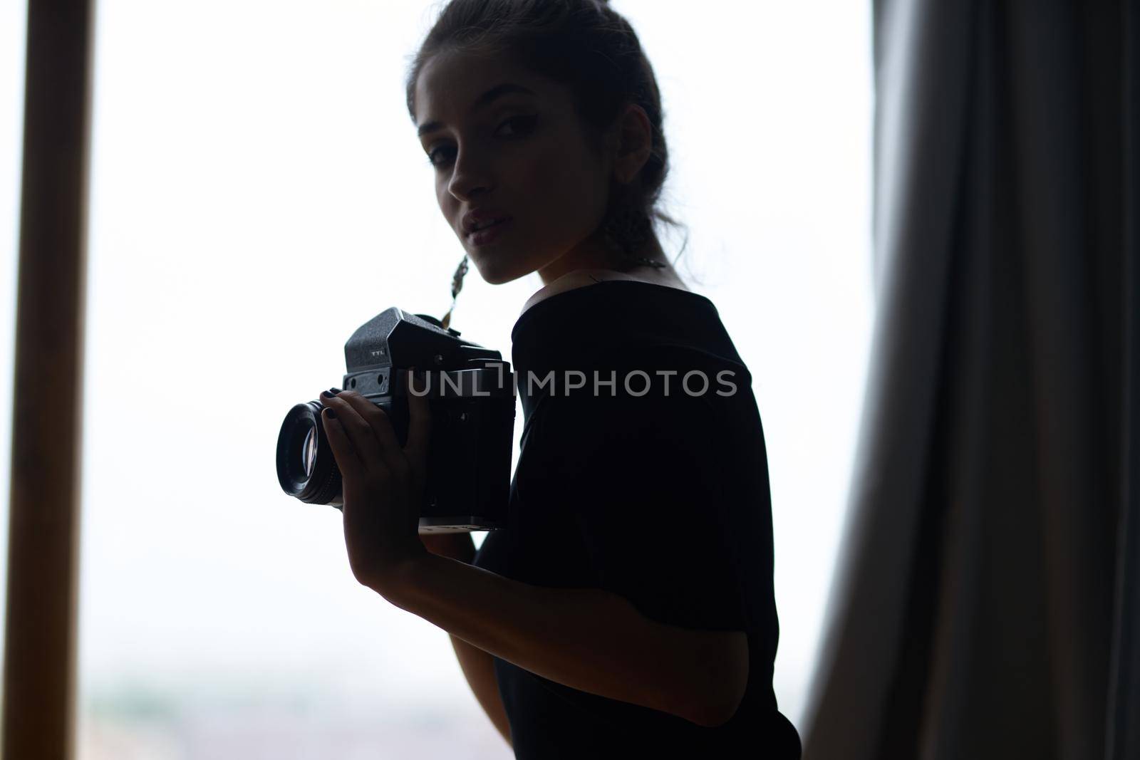 beautiful woman near window posing attractive look earrings lifestyle studio. High quality photo