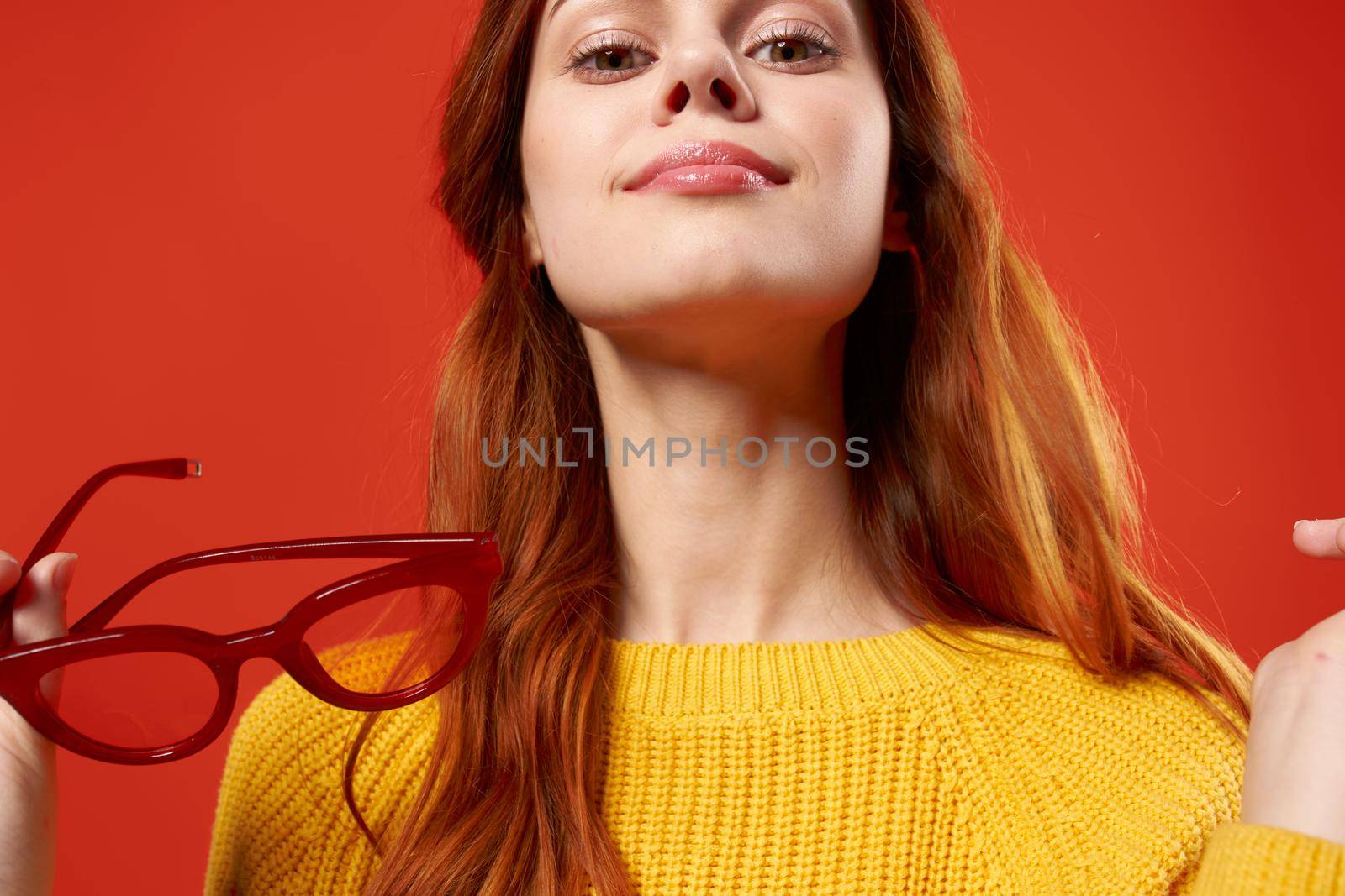 woman with yellow sweater wearing glasses fashion hipster modern style. High quality photo