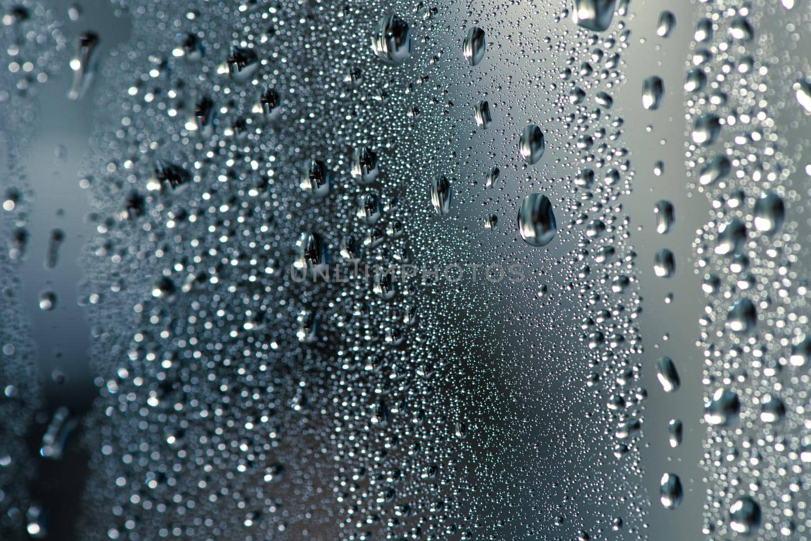 Natural water drops on glass.