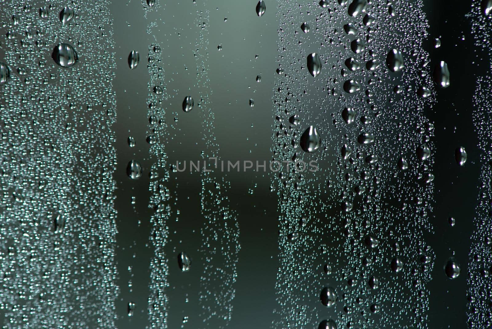 Natural water drops on glass. by thanumporn
