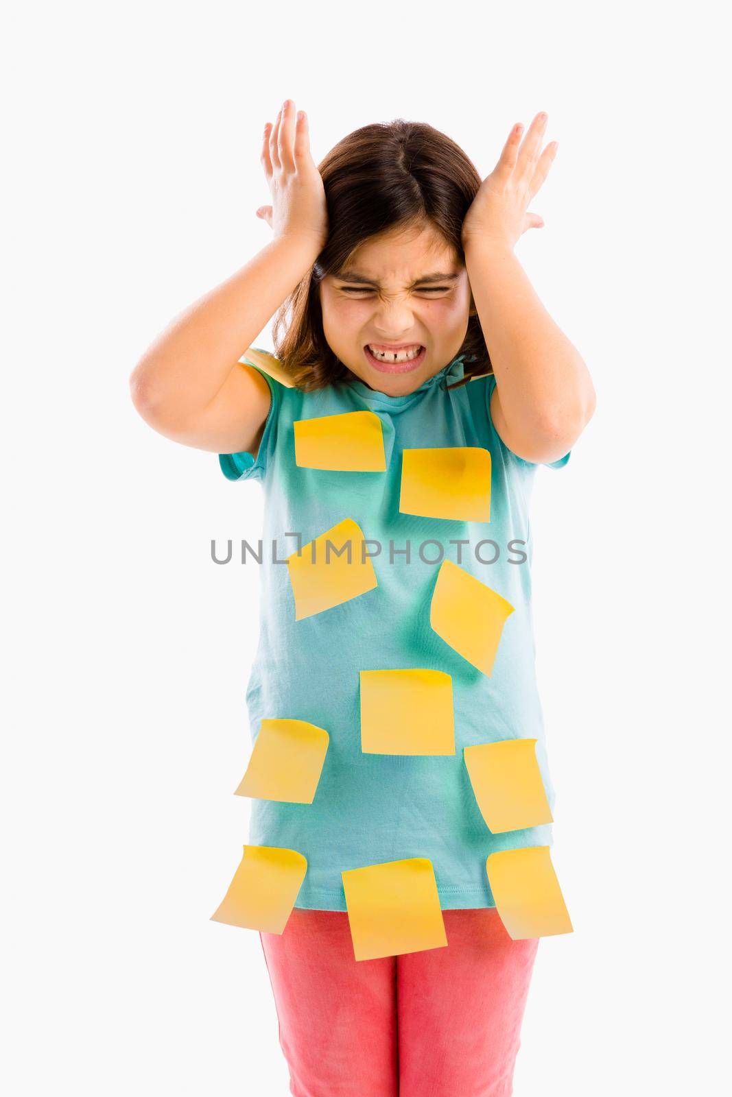 Stressed young girl with yellow notes sticked all over the body