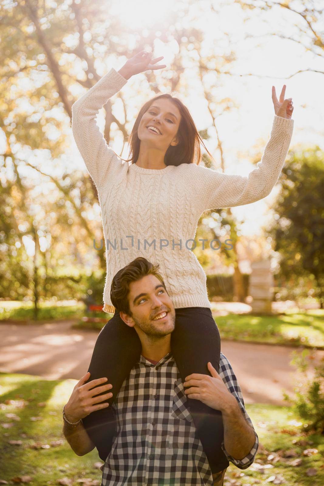 Happy couple in the park having great time