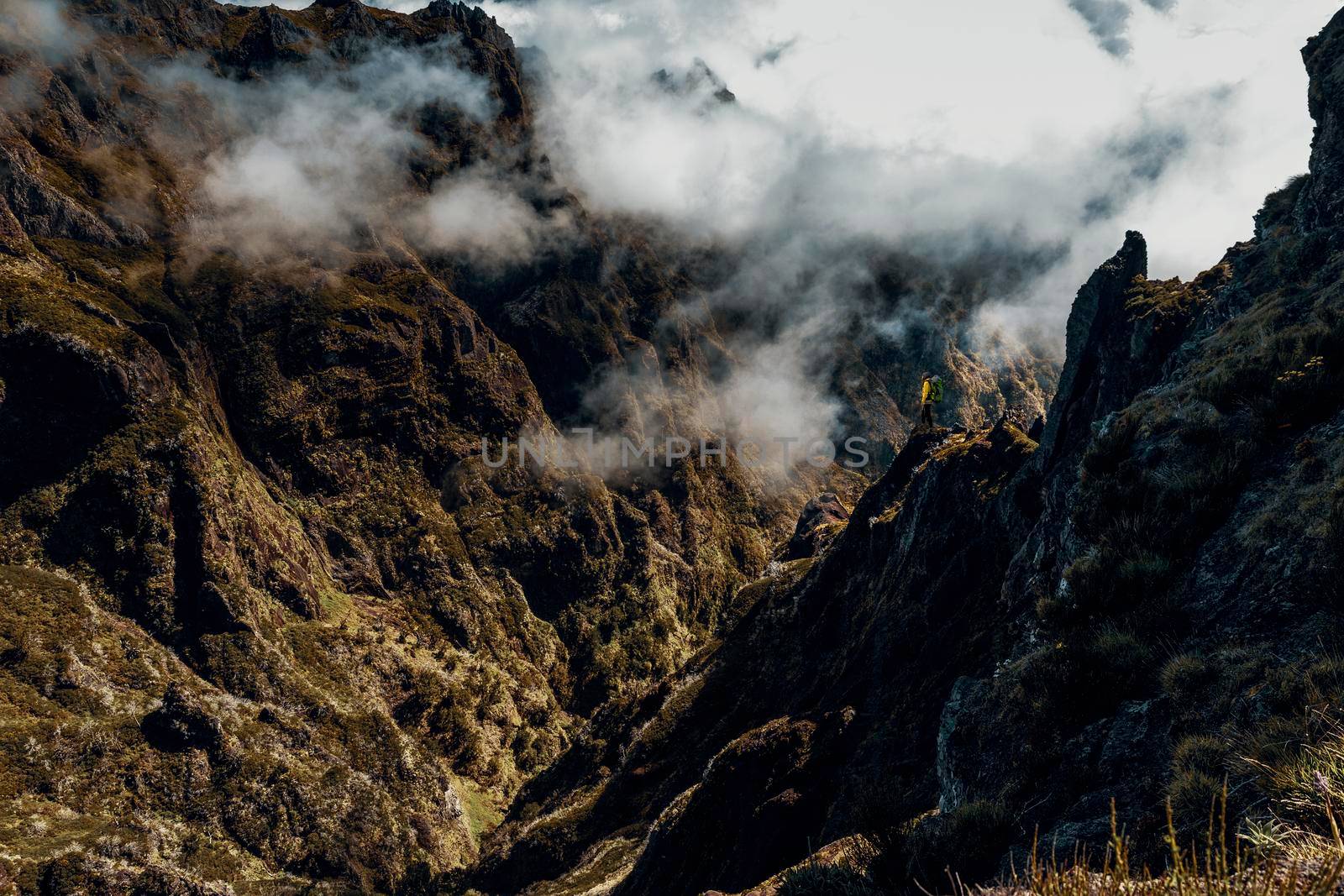 Backpack woman exploring the montains in Madeira Island, Portugal