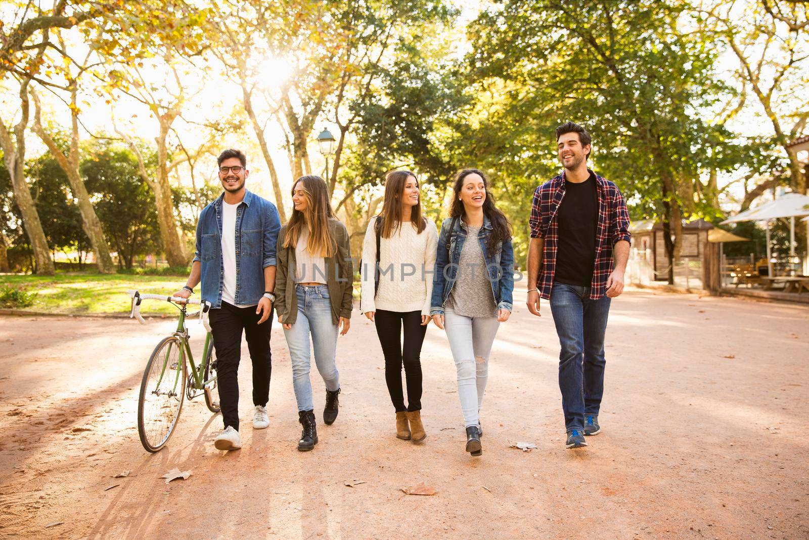 Group of students walking together in the park