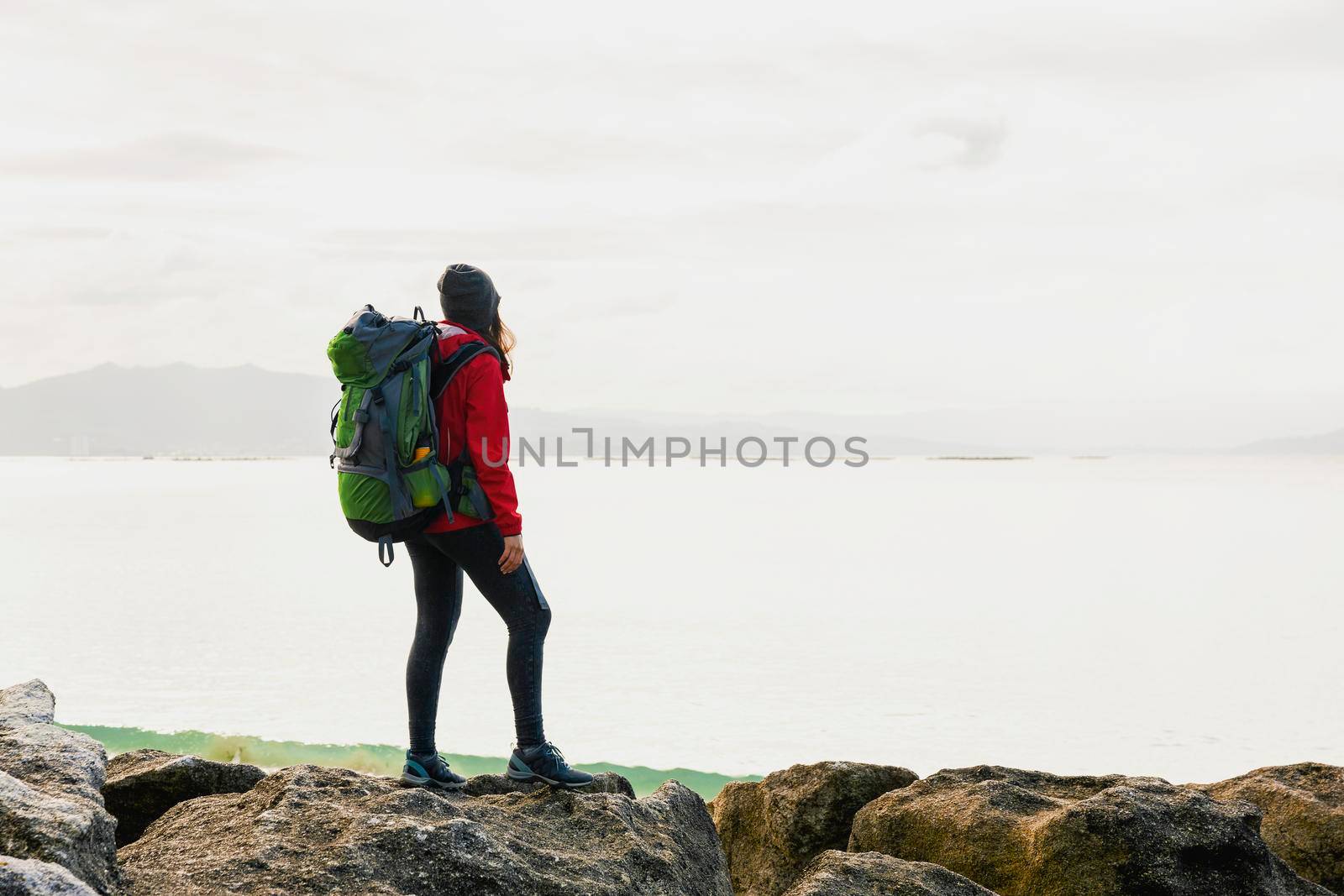 Woman exploring the coast by Iko