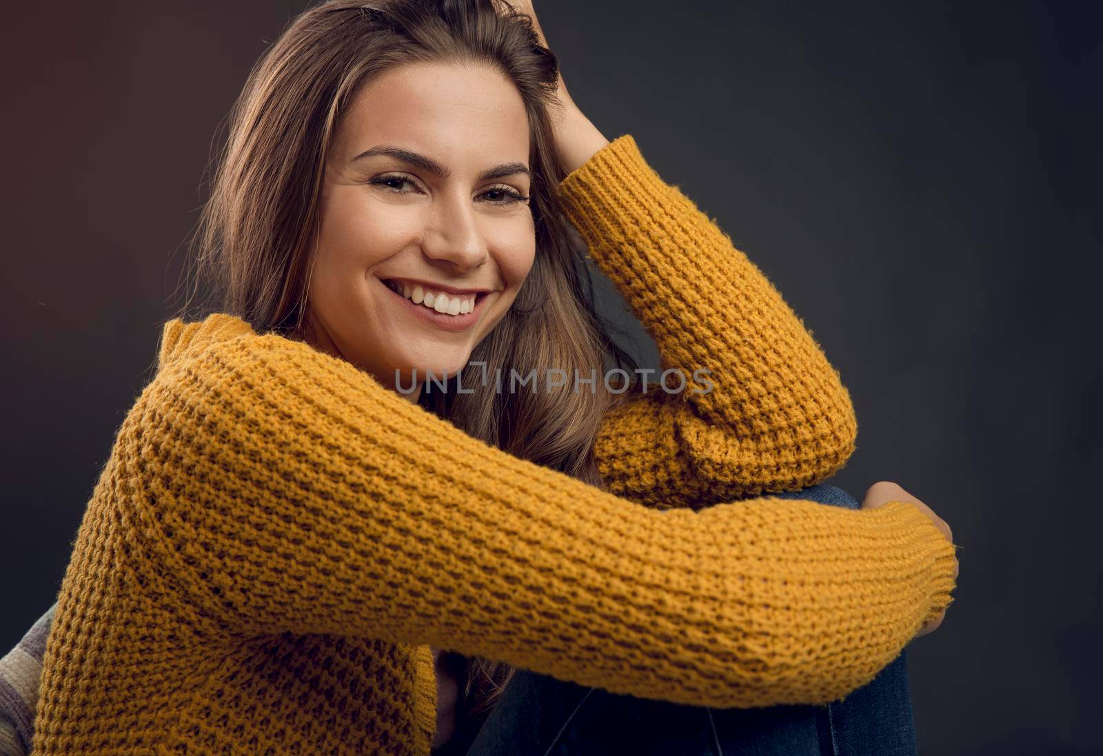 Shot of a beautiful young woman looking to the camera and smiling