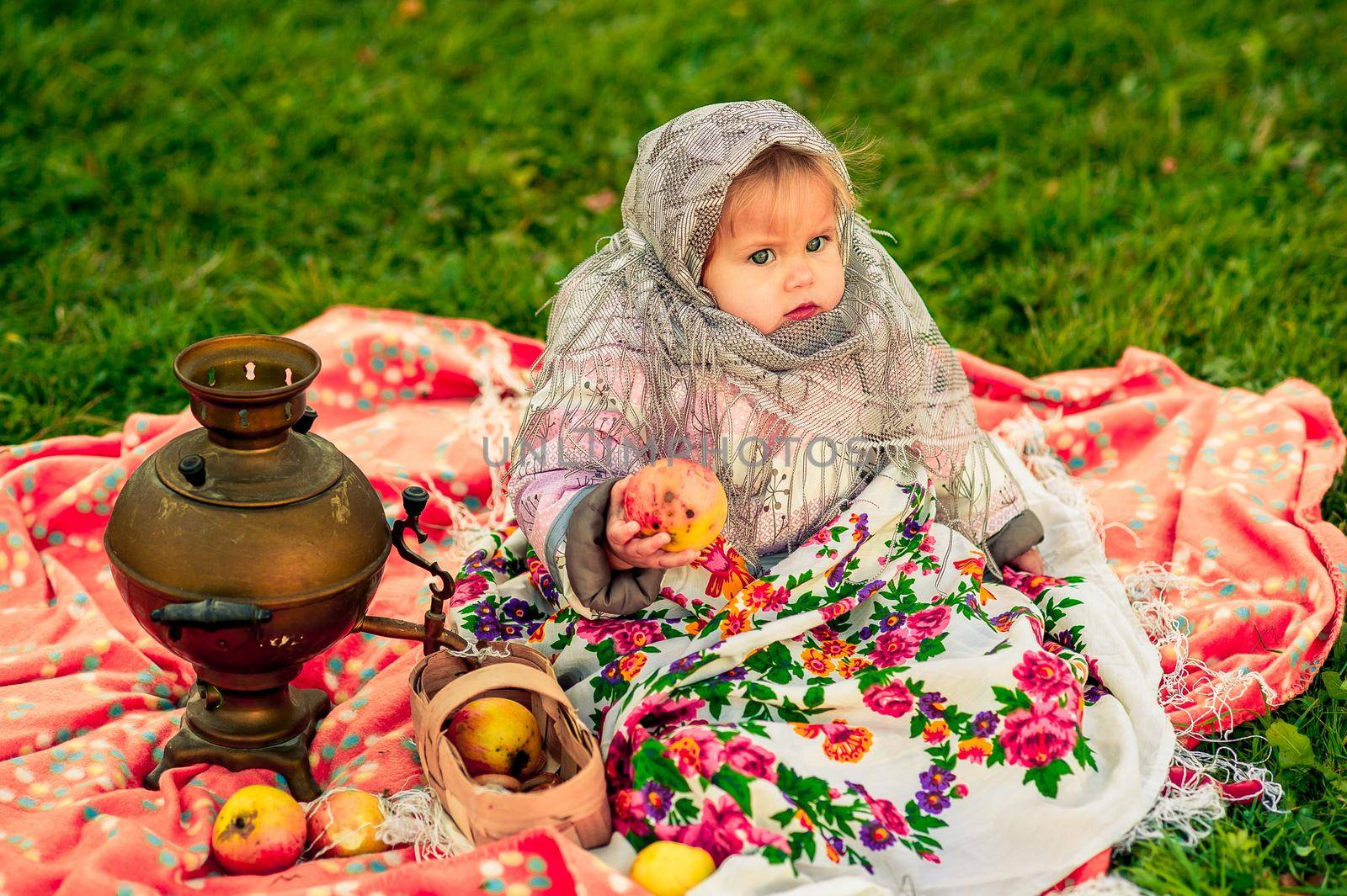 girl in a Russian costume. Little girl in traditional Russian folk costume. by nasdushka