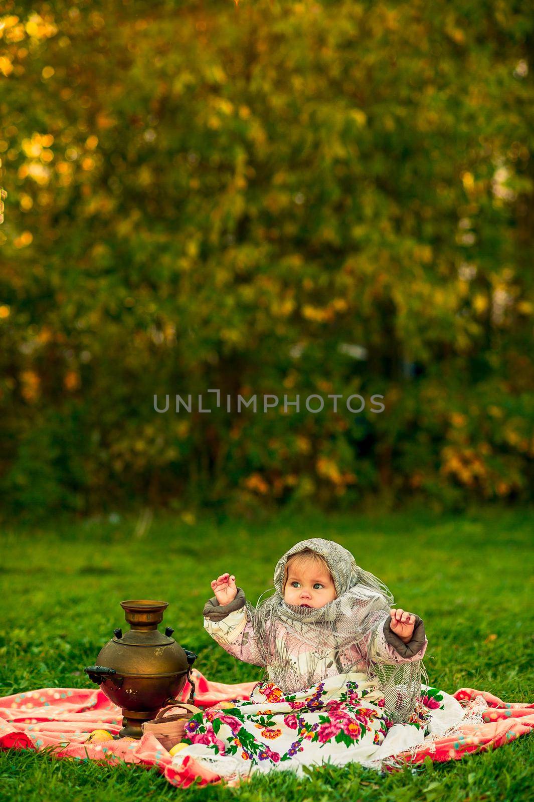 girl in a Russian costume. Little girl in traditional Russian folk costume. by nasdushka