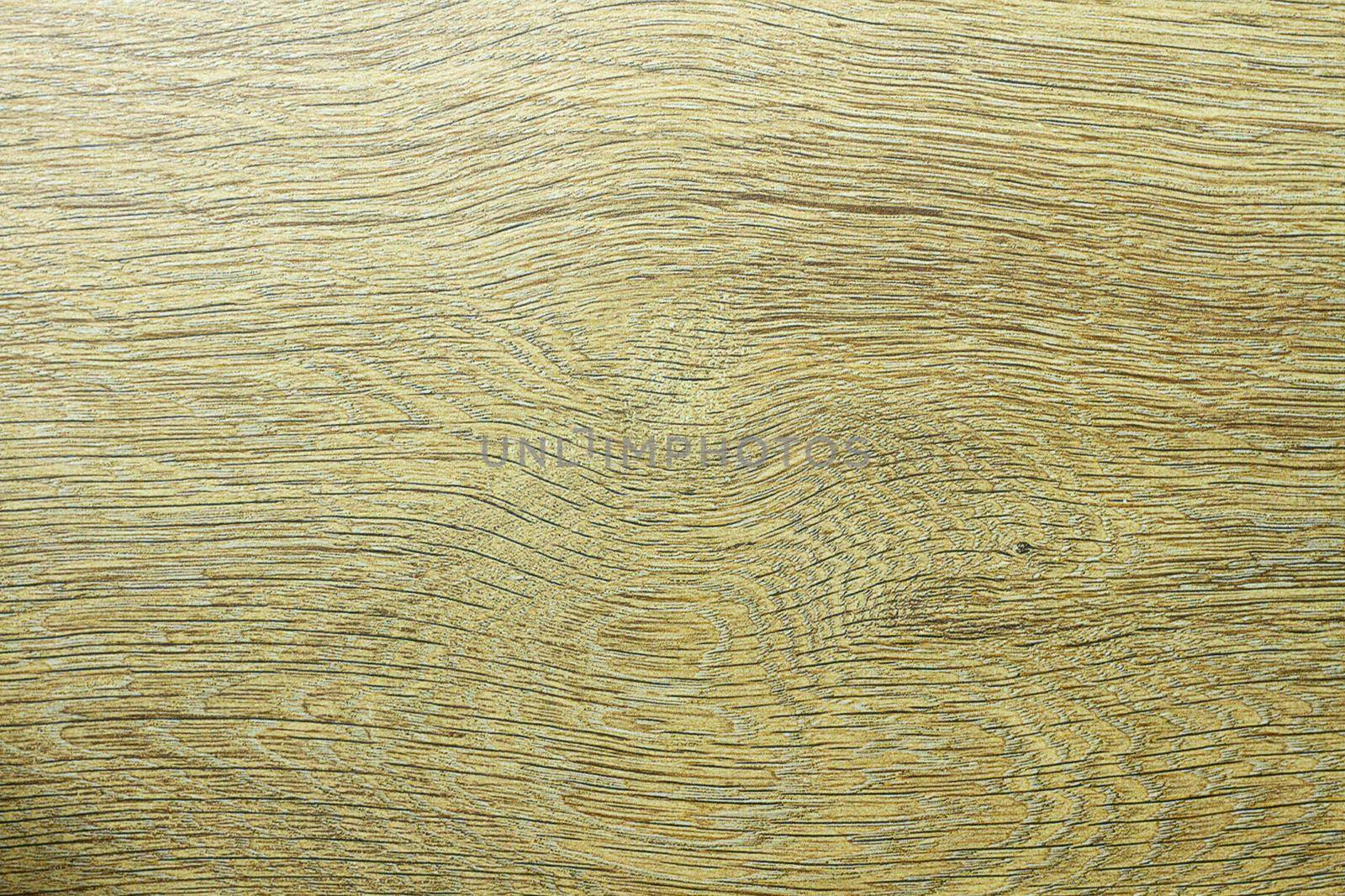 Wood texture. Wooden board close up. The cracks are deep. Laminate flooring. Tree rings in a cut.