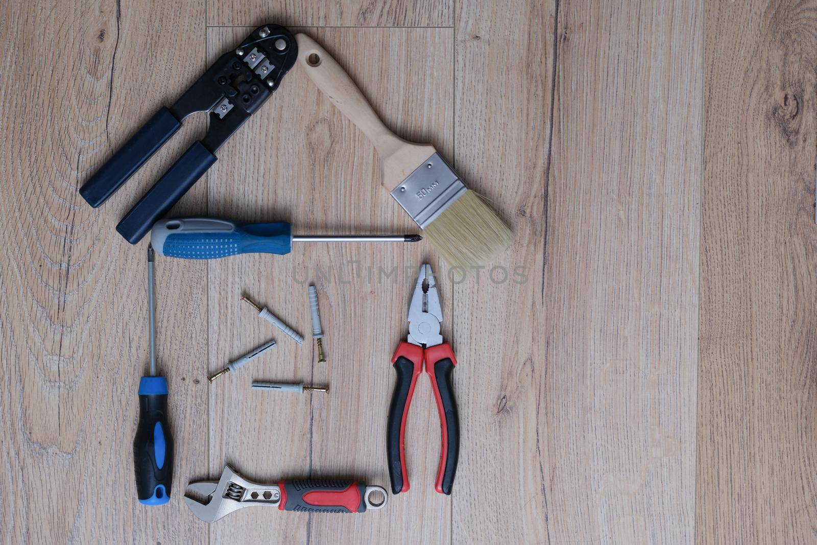 A set of tools for home repair lies on the floor, close-up by kuprevich