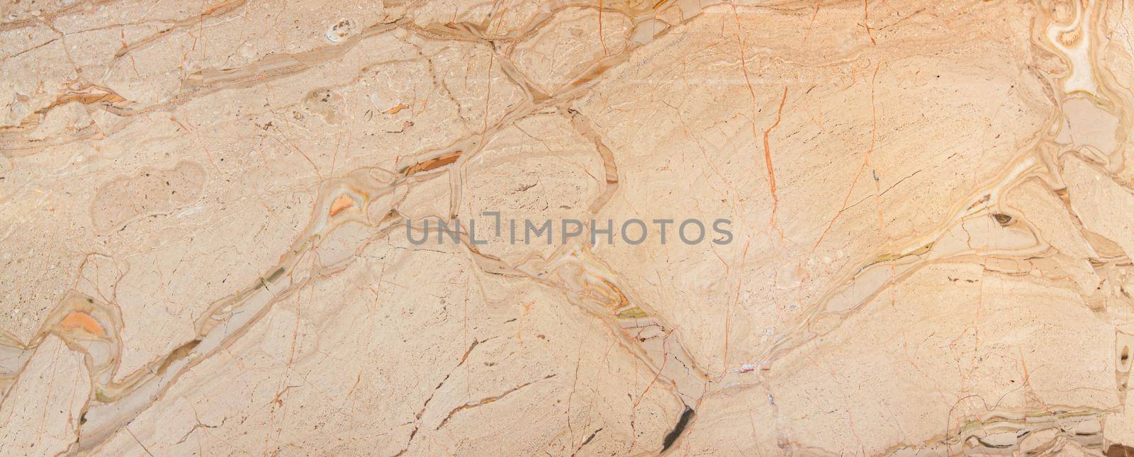 beige color polished natural marble with natural streaks. Used for wall and floor tiles.