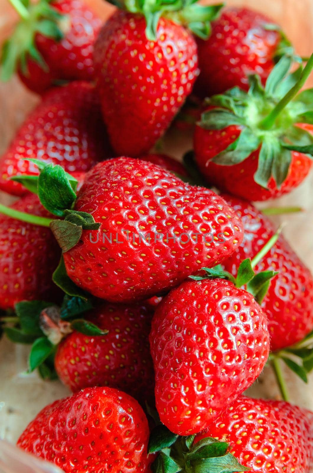 Lots of red ripe strawberry close-up macro by Sergey