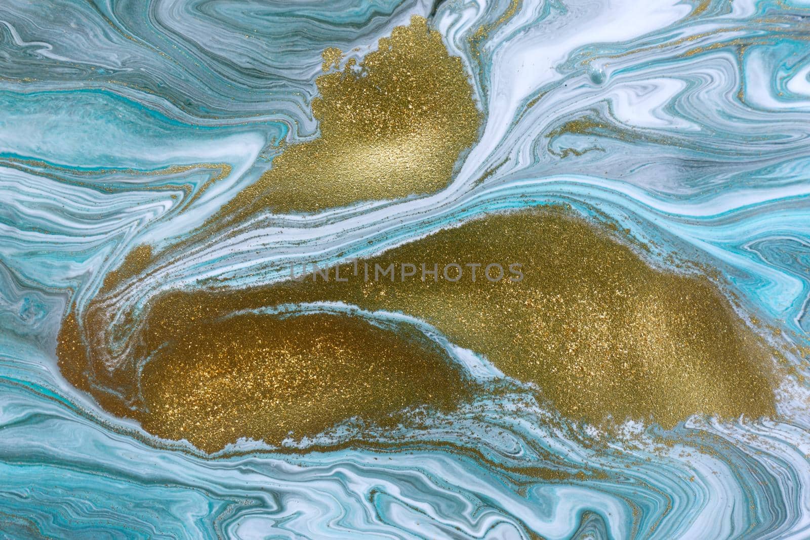 Streams of liquid blue, white and gold ink curls. Waves of fluid turquoise and golden fluid paint