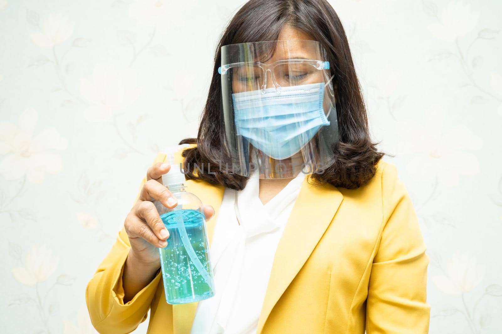 Asian lady wearing mask new normal in office for protect safety infection Covid-19 Coronavirus.