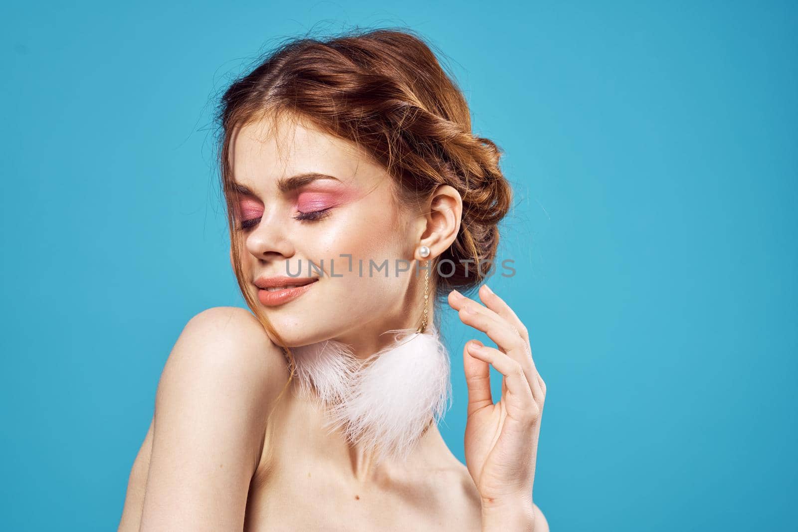 cheerful woman naked shoulders and fluffy earrings bright makeup posing by SHOTPRIME
