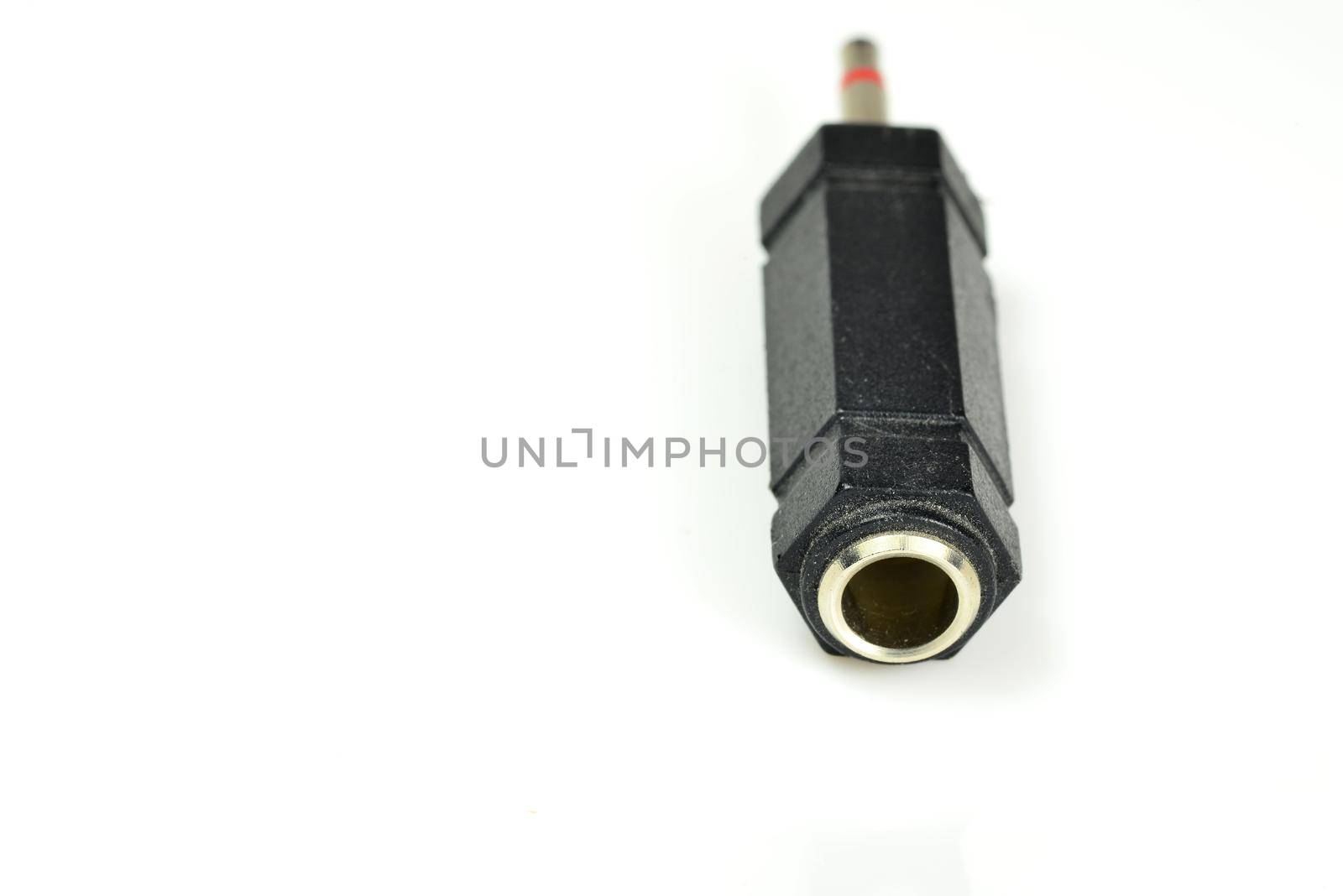 phone jack coupling 6.35 mm to 3.5 mm in a closeup by Jochen