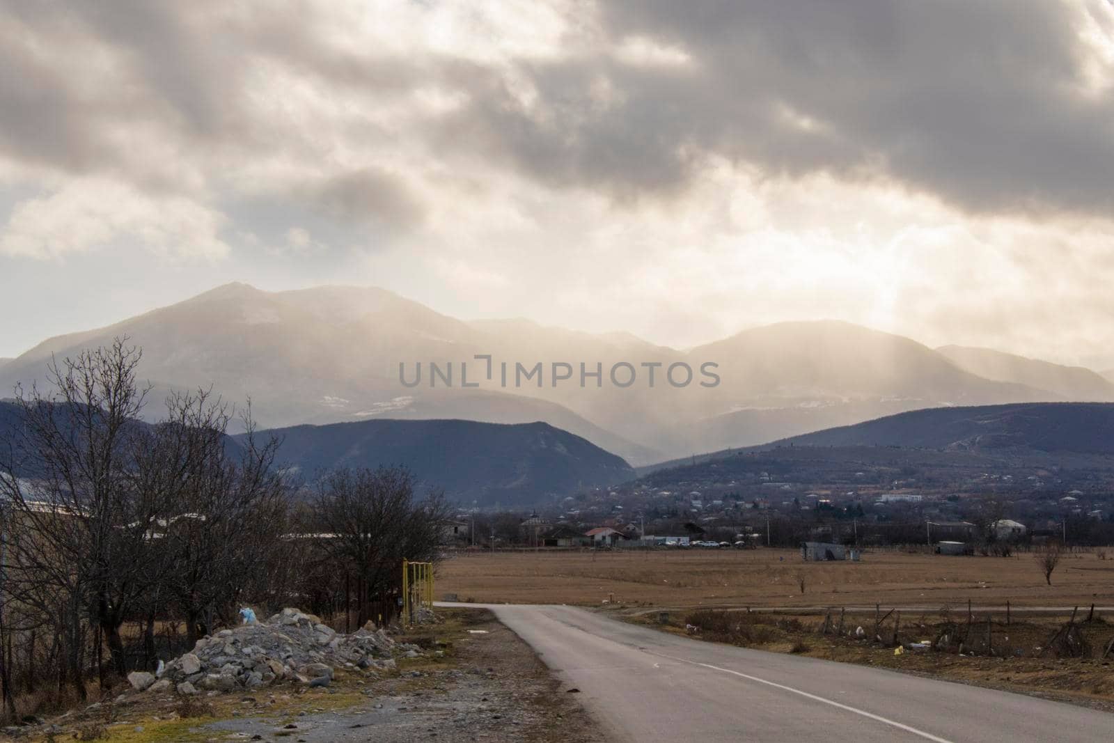 Mountain and town landscape during sunset by Taidundua