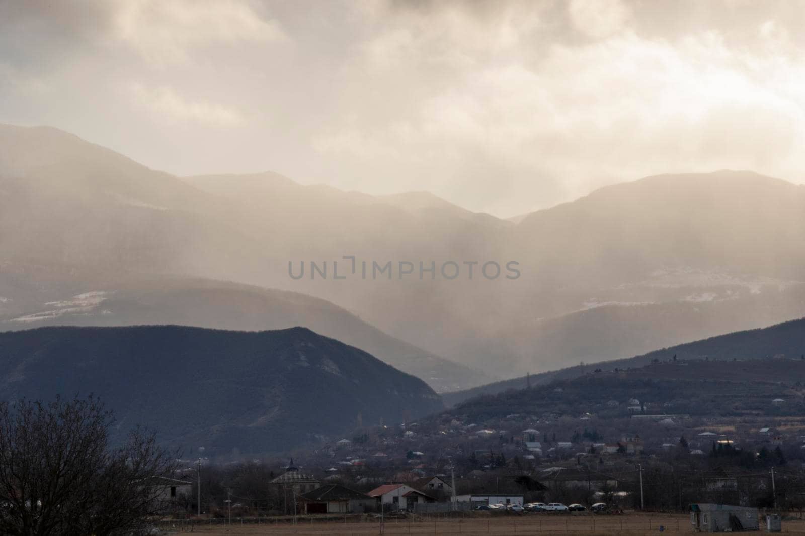 Mountain and town landscape during sunset in Kaspi, Georgia