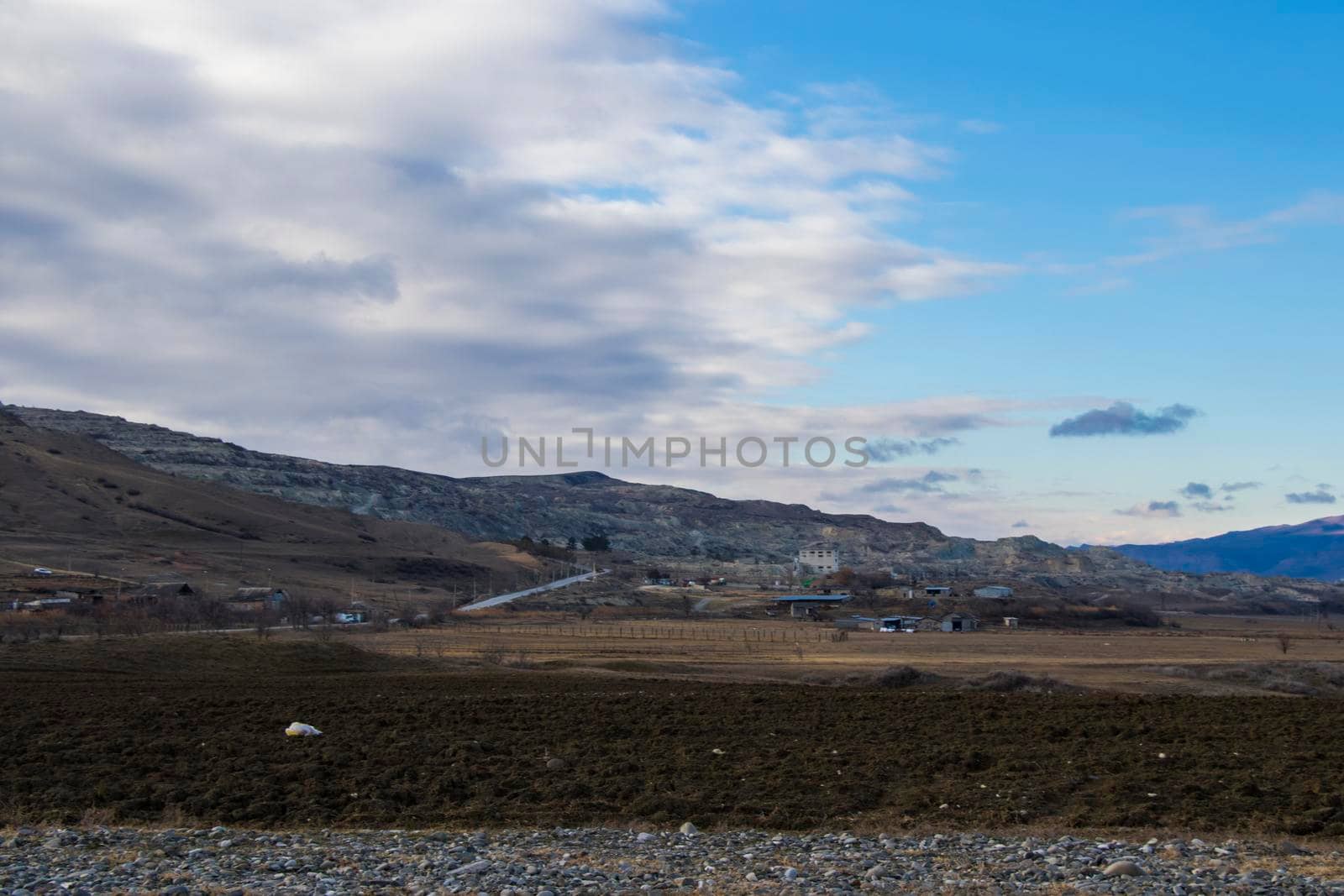 Mountain and town landscape during sunset in Kaspi, Georgia