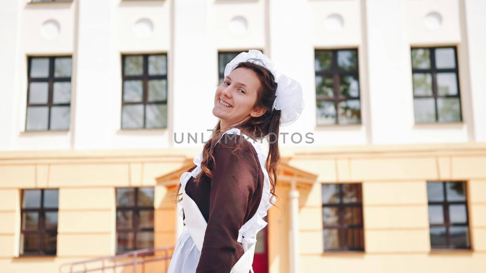 Happy Russian schoolgirl on the last day of school
