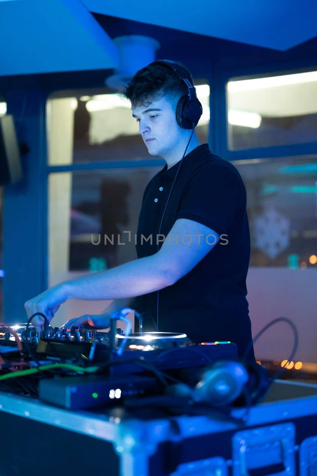 Deejay mixing at party. High quality photography.