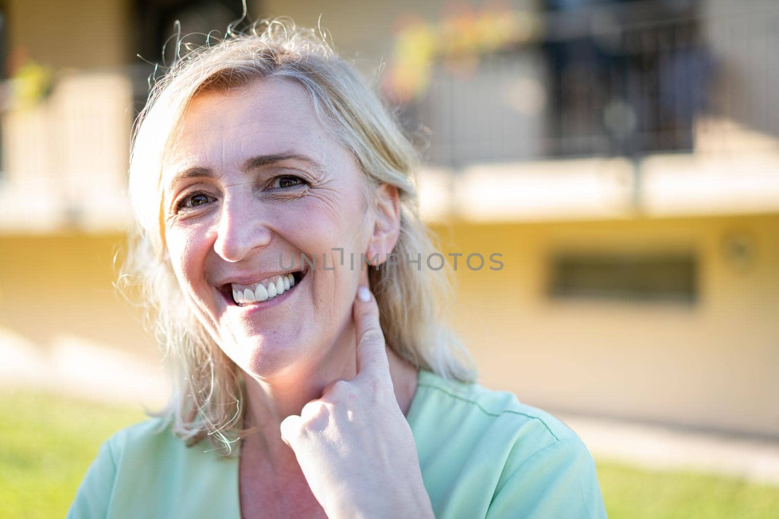 Portrait of the nurse with green uniform outdoors