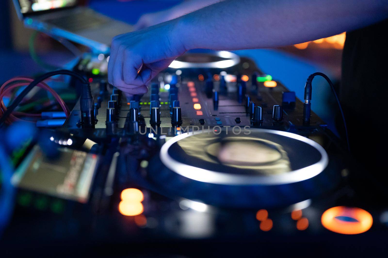 Dj mixing at party festival with light and smoke in background - Summer nightlife view of disco club inside. by HERRAEZ