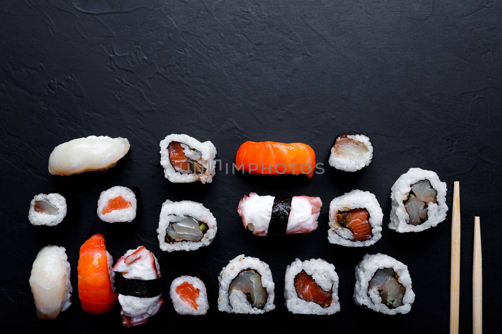 japanese sushi food. Maki ands rolls with tuna, salmon, shrimp, crab and avocado. Top view of assorted sushi. by lifesummerlin