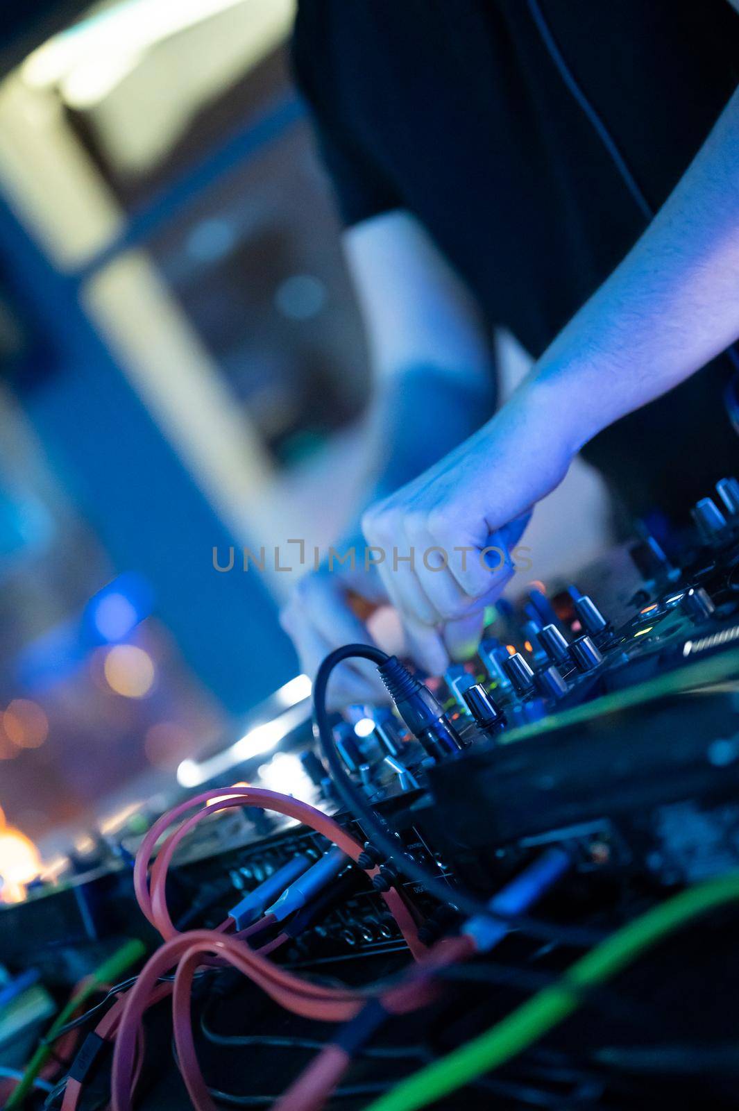 Deejay mixing at party. High quality photography.