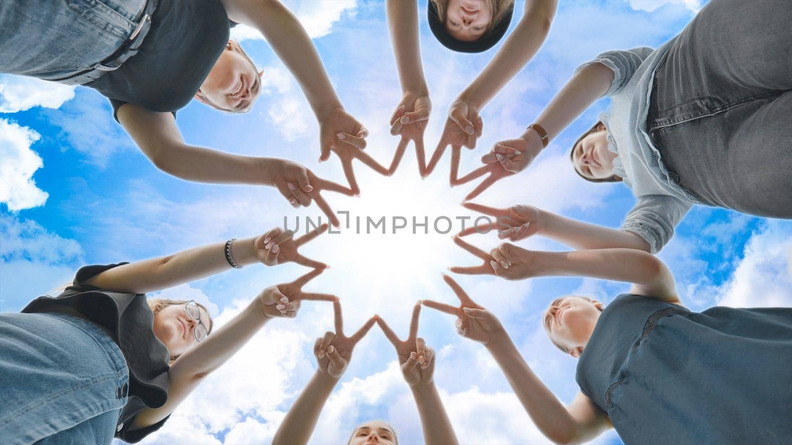 Girlfriends girls make circle shapes from their fingers and hands and then connect them