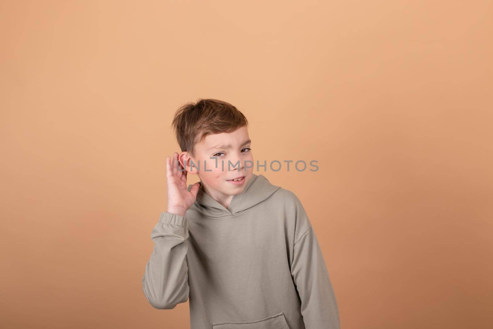 Teen boy portrait teenager isolated on brown background. emotions on face. feelings and facial expression concept. advertisement. copy free space for text.