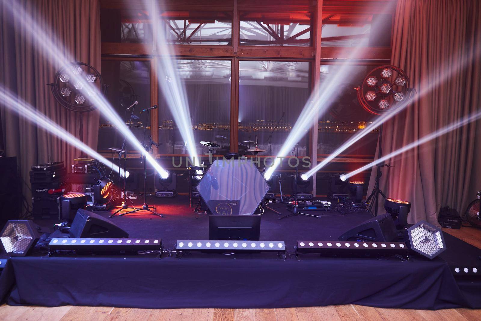 Stunning and powerful nightclub stage illumination before concert. High quality photo