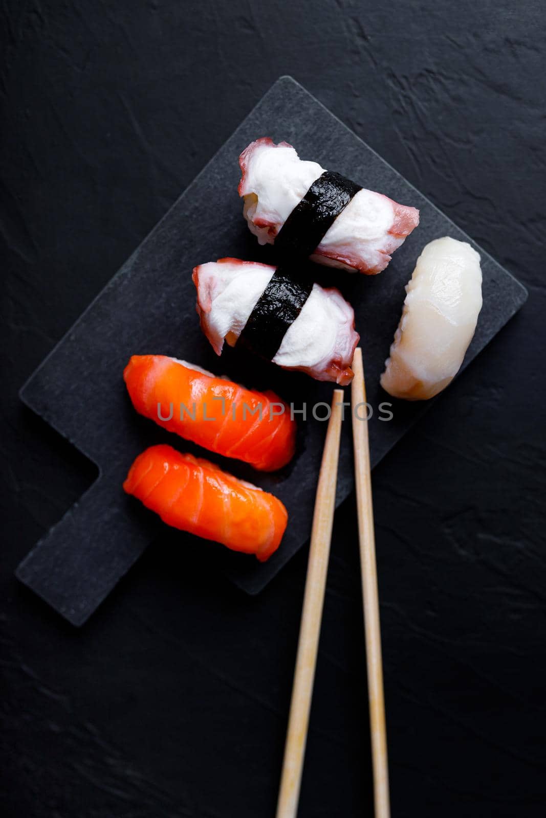 japanese sushi food. Maki ands rolls with tuna, salmon, shrimp, crab and avocado. Top view of assorted sushi