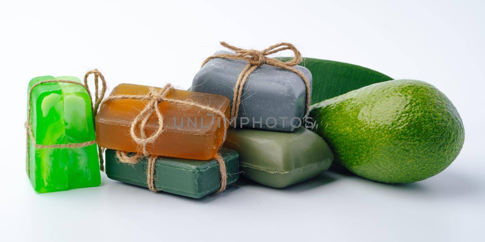 Soap bar with avocado on white background by Fabrikasimf