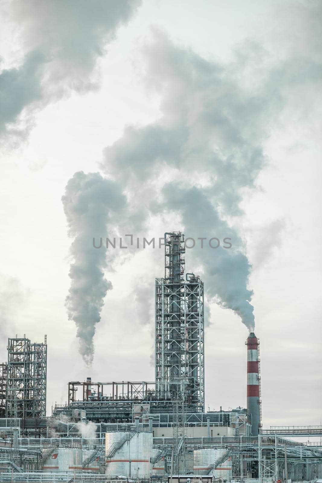 Petrochemical industrial factory of heavy industry, power refinery production with smoke pollution.Thick smoke is coming from the factory's chimney. smoke smog emissions bad ecology aerial photography