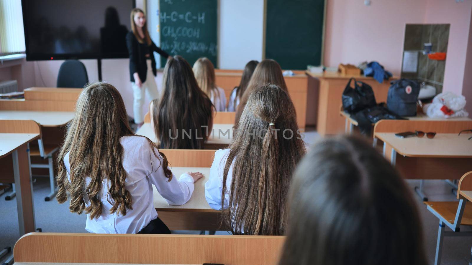 Pupils of the 11th grade in the class at the desks during the lesson. Russian school. by DovidPro