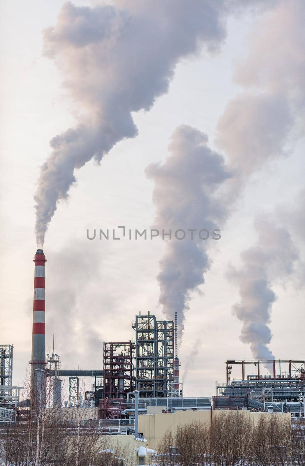 Petrochemical industrial factory of heavy industry, power refinery production with smoke pollution.Thick smoke is coming from the factory's chimney. smoke smog emissions bad ecology aerial photography
