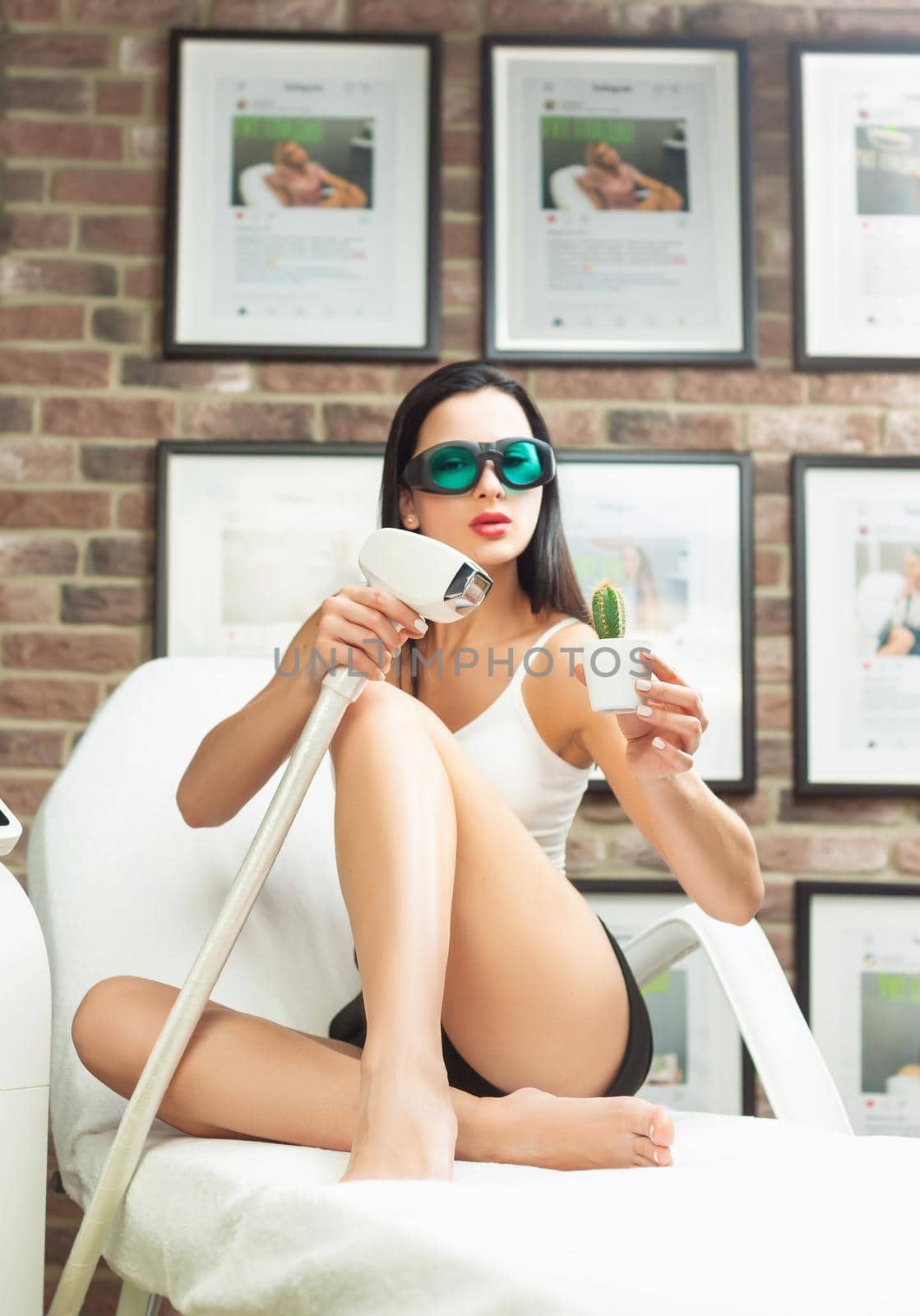 woman in a laser hair removal studio with a cactus in her hand as a symbol of unwanted hair growth