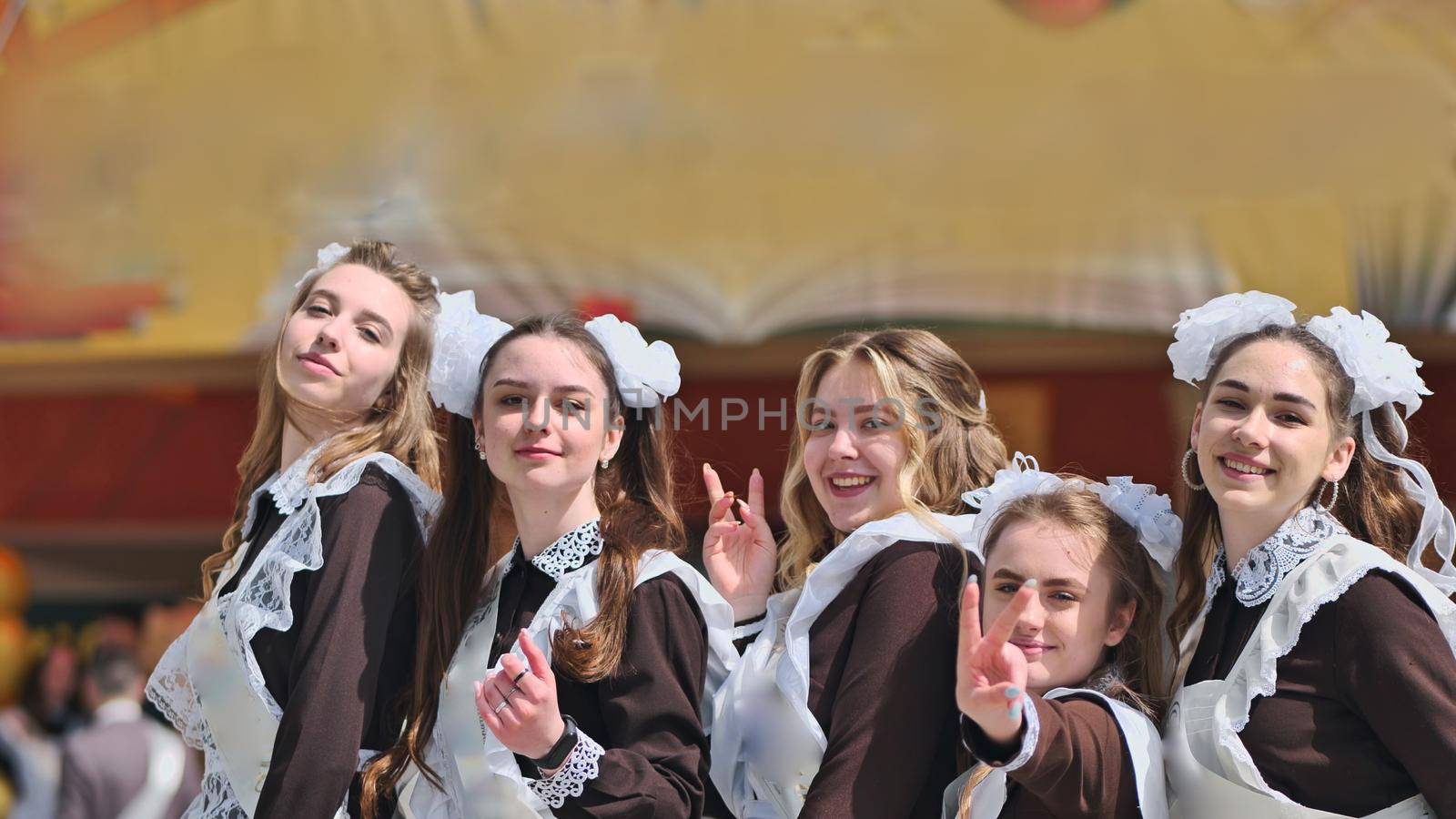 Happy Russian female graduates pose on their graduation day