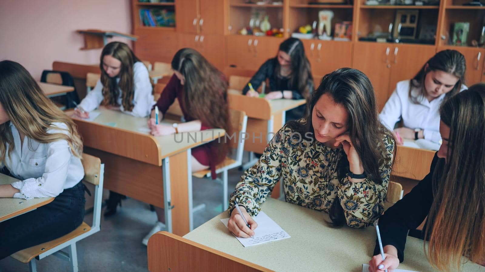 Pupils of the 11th grade in the class at the desks during the lesson. Russian school