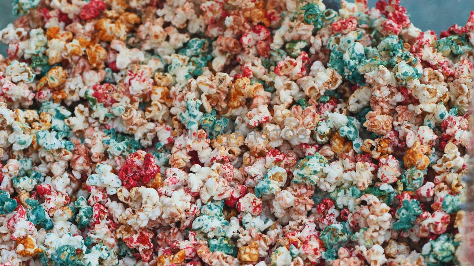 Colored and delicious fried popcorn on the street