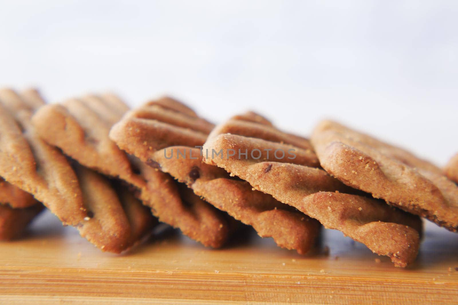 close up of sweet cookies on wooden table .
