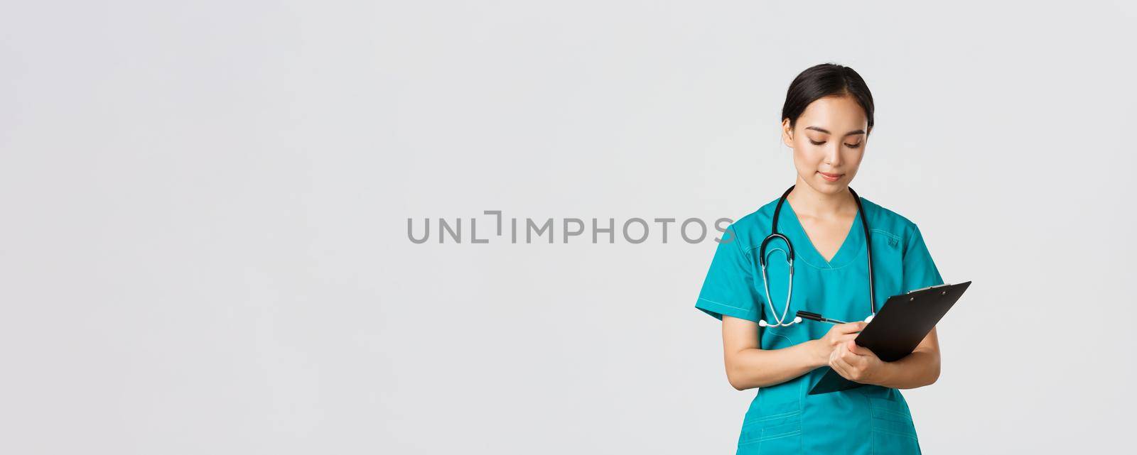 Healthcare workers, preventing virus, quarantine campaign concept. Serious-looking professional female doctor, nurse in scrubs writing down info on clipboard, examine patient, white background.