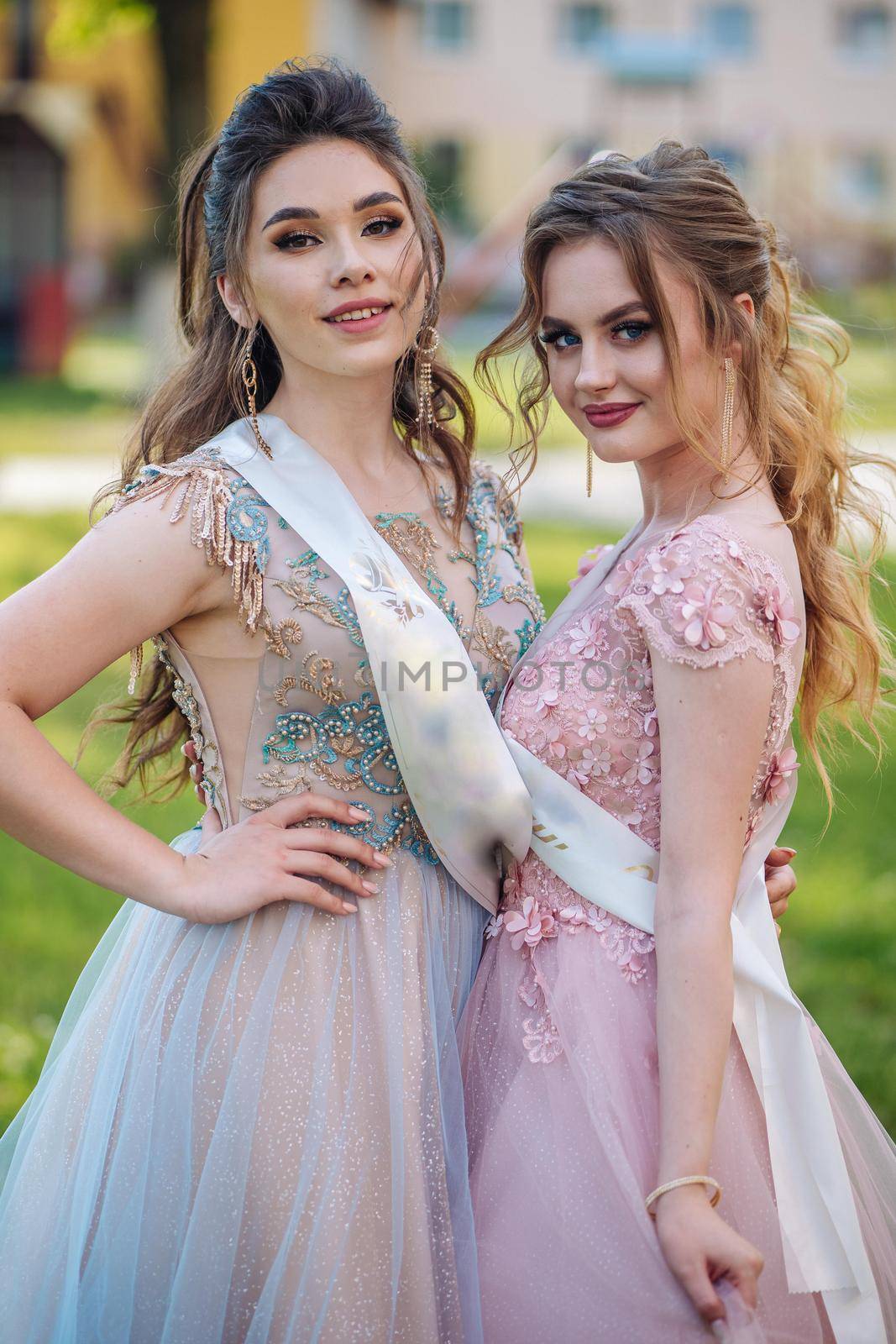 Beautiful schoolgirls in dress at the prom at school. by DovidPro