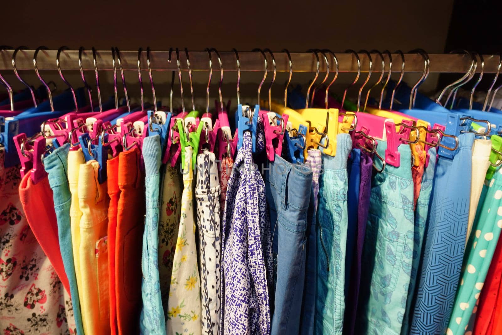 close up of many child cloths display for sale .